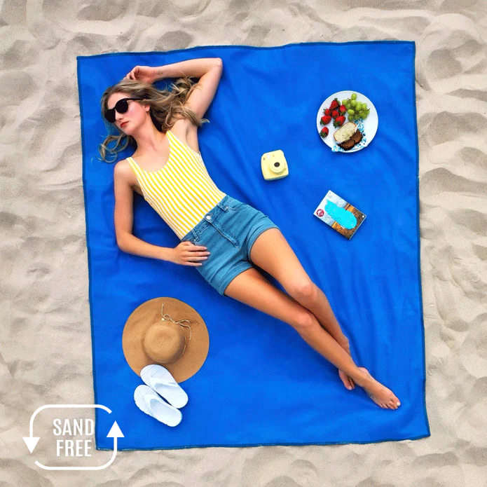 woman on the beach lying on the C-Gear Original Sand-Free
