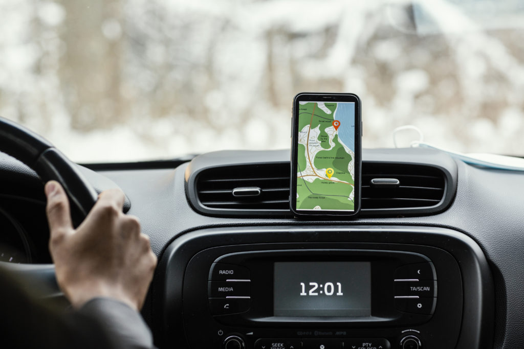 Smartphone in the car with maps for navigation