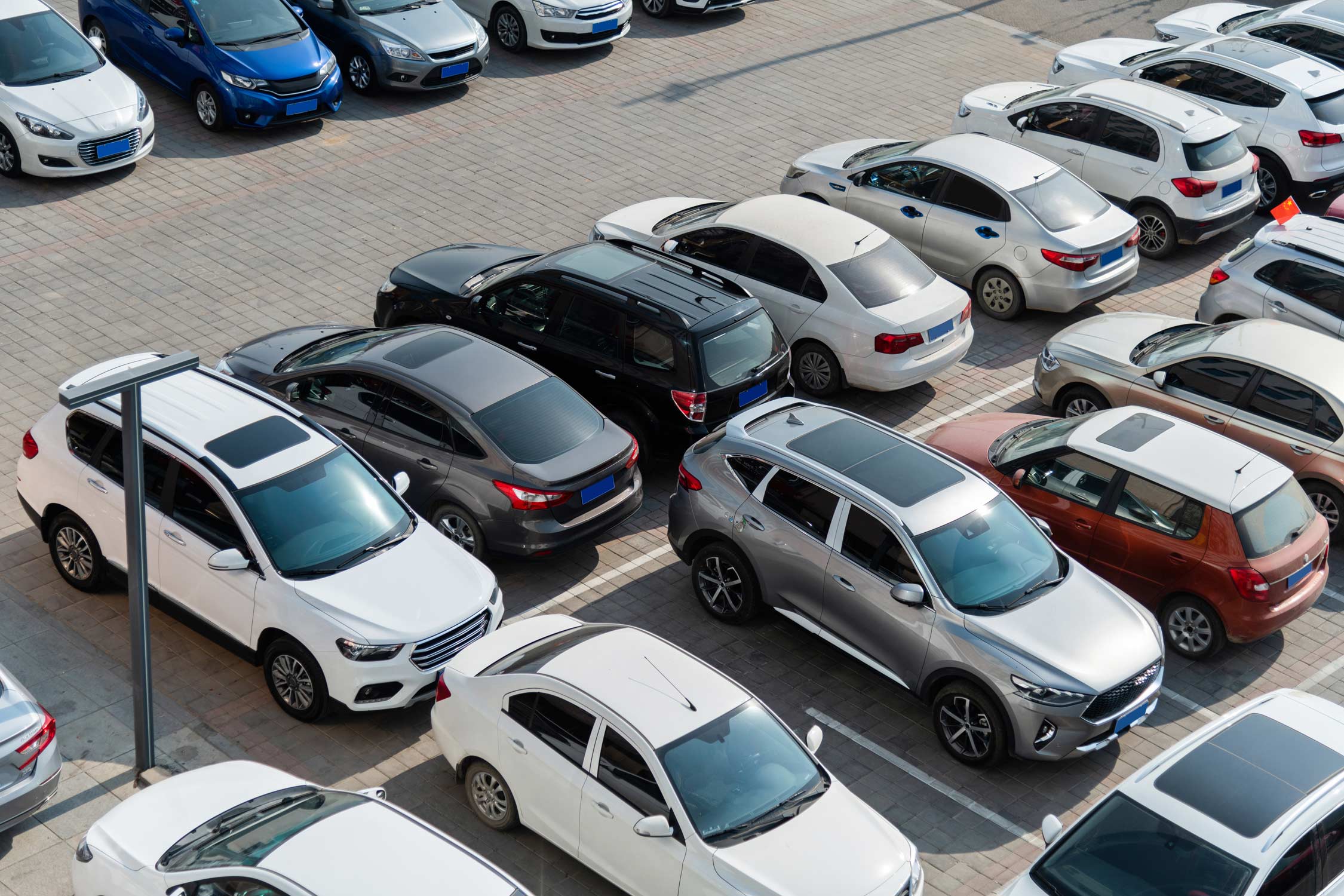 Cars of different models and brands in a parking