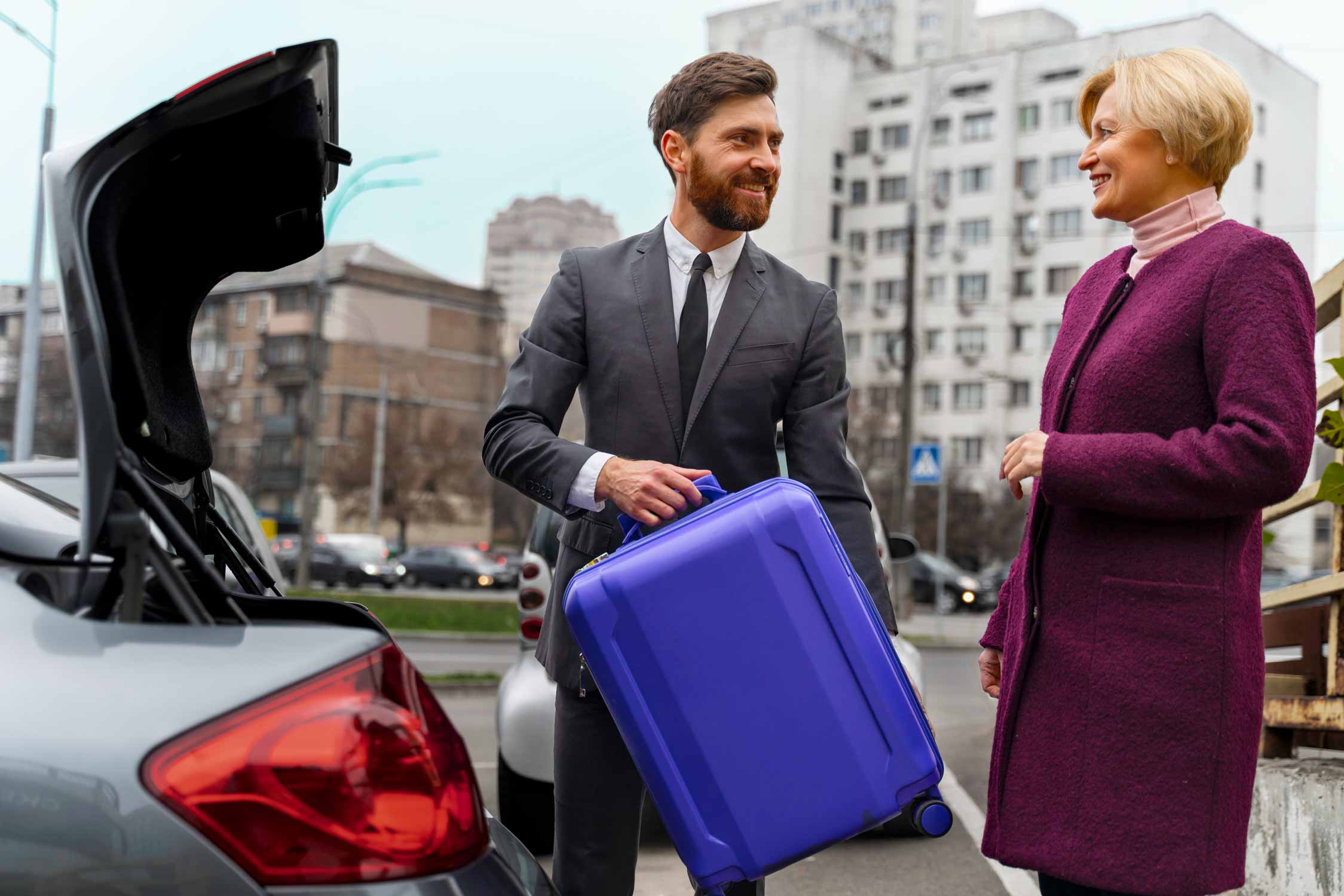 Taxi driver helping his female client